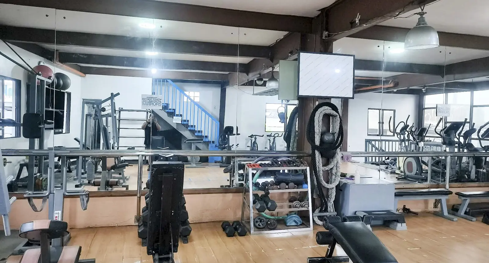 Gym floor with mirrors and strength equipment