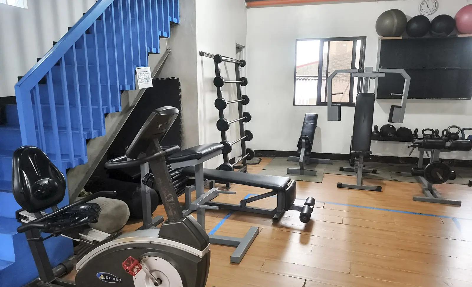Spacious training area with free weights